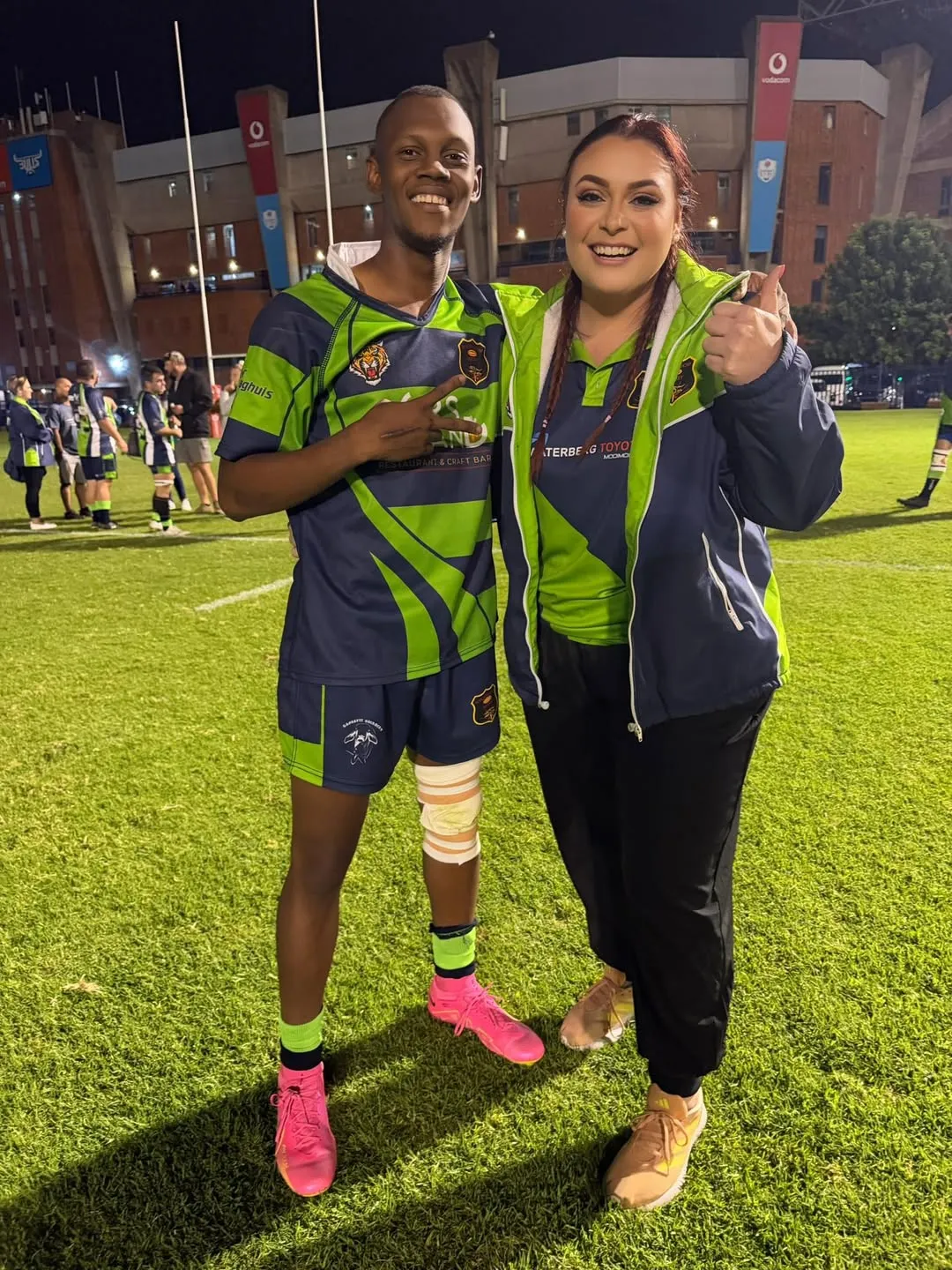 Yvonne with a Nylstroom player under floodlights
